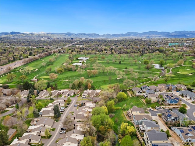 birds eye view of property featuring a water and mountain view, golf course view, and a residential view
