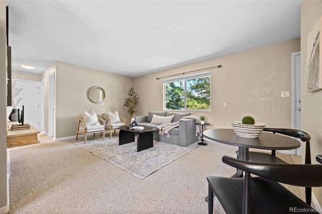 2380 W Baltic Pl, Englewood, CO 80110 - carpeted living room featuring baseboards