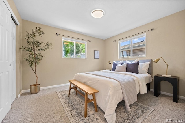 2380 W Baltic Pl, Englewood, CO 80110 - bedroom featuring light colored carpet and a closet