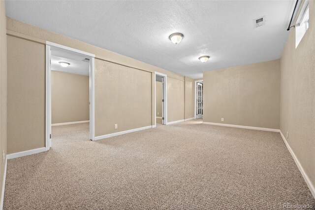 2380 W Baltic Pl, Englewood, CO 80110 - basement featuring a textured ceiling, carpet flooring, and a textured wall