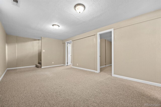 2380 W Baltic Pl, Englewood, CO 80110 - finished basement with a textured ceiling, carpet, and stairs