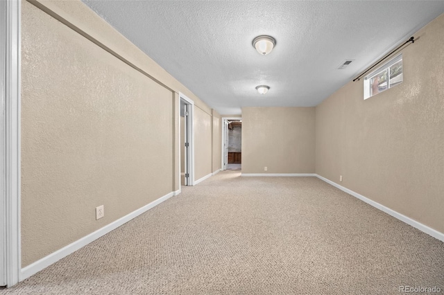 2380 W Baltic Pl, Englewood, CO 80110 - carpeted spare room featuring a textured ceiling and a textured wall