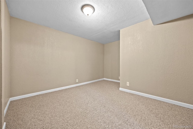 2380 W Baltic Pl, Englewood, CO 80110 - empty room with carpet floors, a textured ceiling, and a textured wall