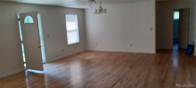 interior space with a healthy amount of sunlight and hardwood / wood-style floors