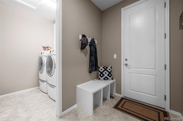 827 Sundance Ln, Erie, CO 80516 - washroom with washing machine and clothes dryer, baseboards, and laundry area