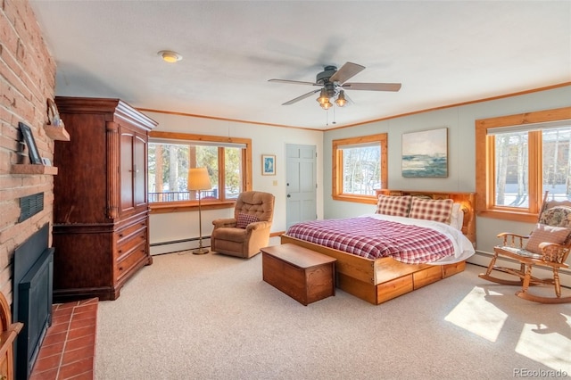 carpeted bedroom with a large fireplace, multiple windows, and baseboard heating