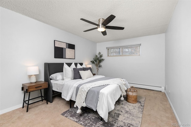 bedroom with a baseboard radiator, baseboards, a textured ceiling, and carpet