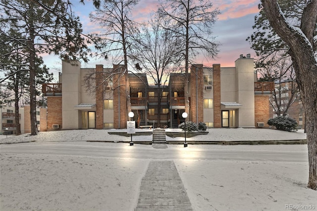 view of property at dusk