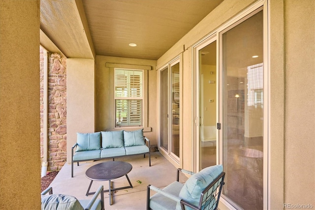 balcony with outdoor lounge area and a patio area