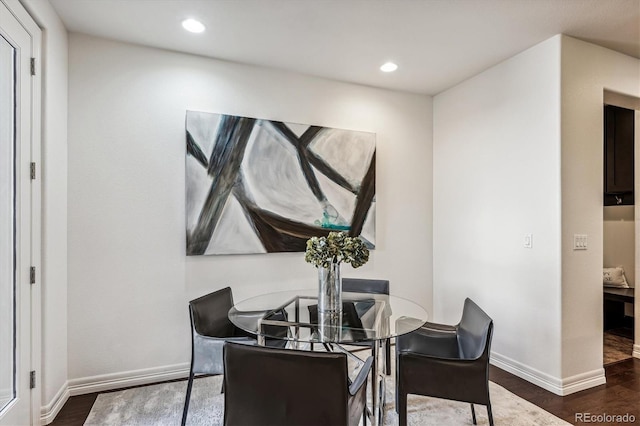 dining area featuring dark hardwood / wood-style floors