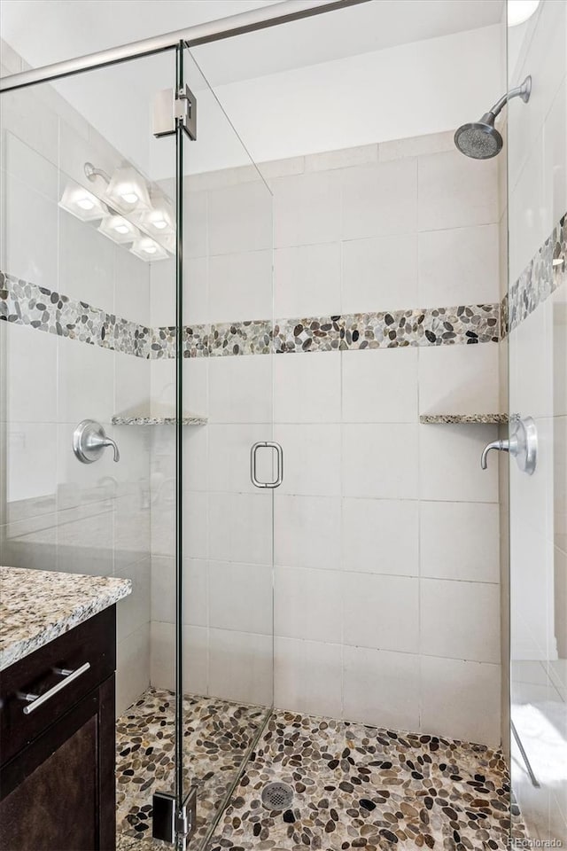 bathroom featuring vanity and walk in shower