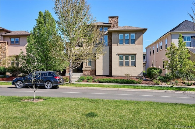 view of front facade with a front lawn