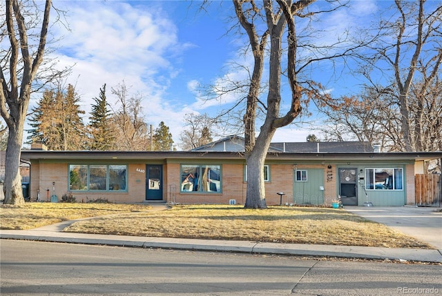 ranch-style home with a front yard