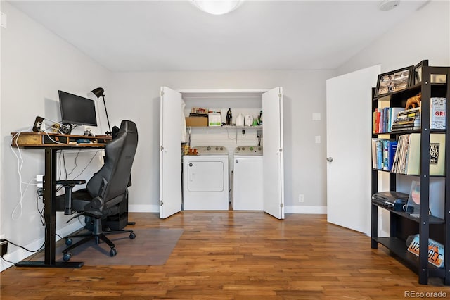 home office with washing machine and dryer, lofted ceiling, and hardwood / wood-style floors