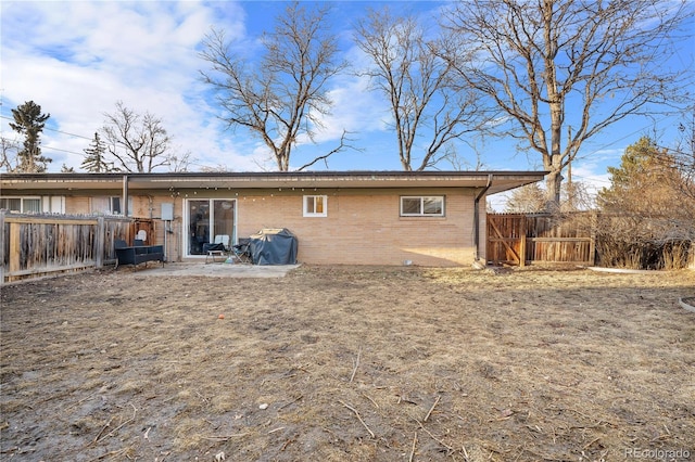 rear view of house with a patio