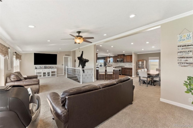39245 Big Springs Rd, Rush, CO 80833 - living area featuring recessed lighting, baseboards, crown molding, and light colored carpet
