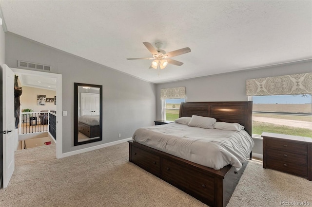 39245 Big Springs Rd, Rush, CO 80833 - carpeted bedroom with ceiling fan, baseboards, visible vents, and vaulted ceiling