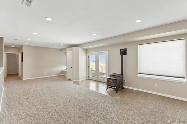 39245 Big Springs Rd, Rush, CO 80833 - unfurnished living room with french doors, recessed lighting, visible vents, and light colored carpet