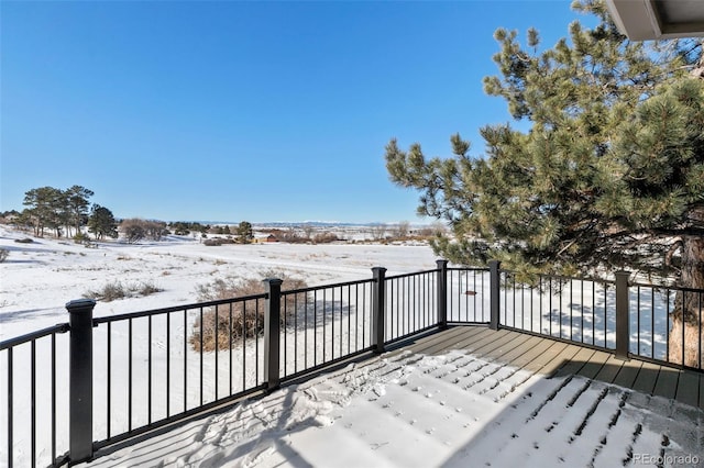 view of snow covered deck