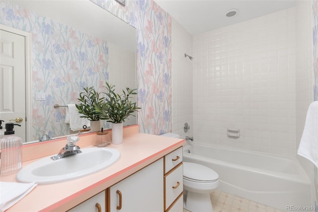 full bathroom featuring vanity, toilet, and  shower combination