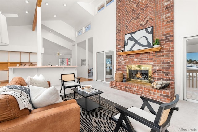 living room featuring ceiling fan, light colored carpet, a fireplace, and high vaulted ceiling