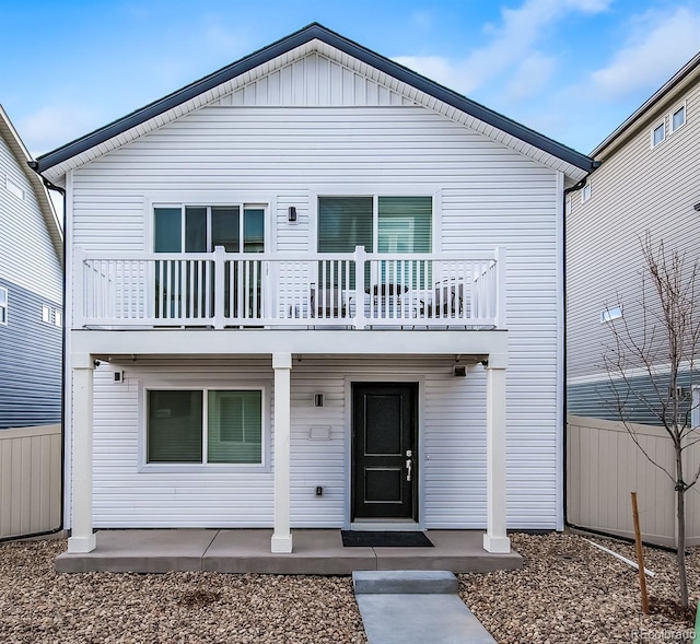 13585 E 103rd Pl, Commerce City, CO 80022 - view of front facade featuring a balcony and a patio
