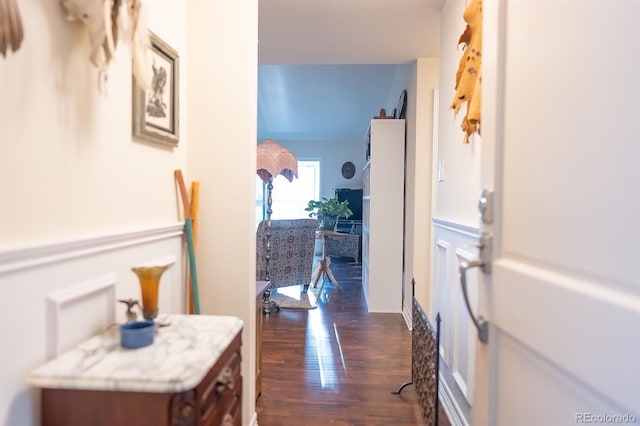 hall with dark wood-type flooring