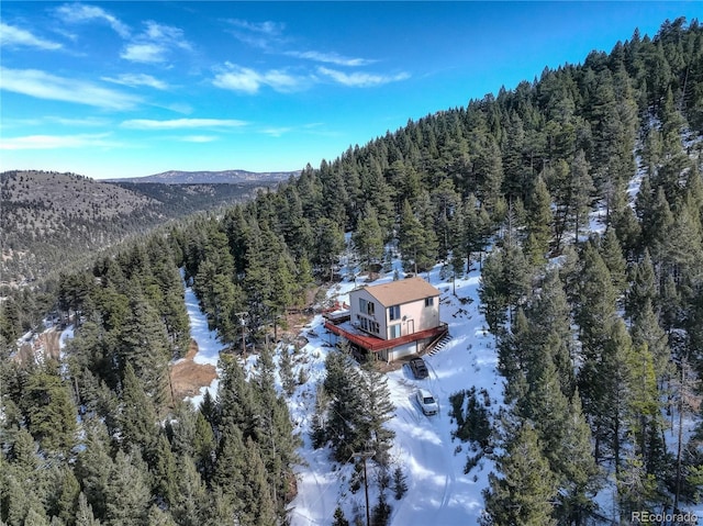 snowy aerial view featuring a mountain view