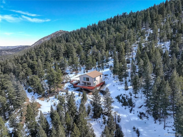 snowy aerial view featuring a mountain view