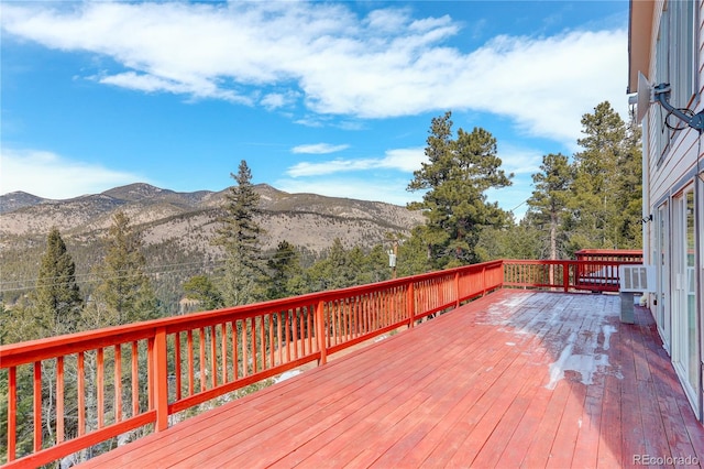 wooden terrace featuring a mountain view