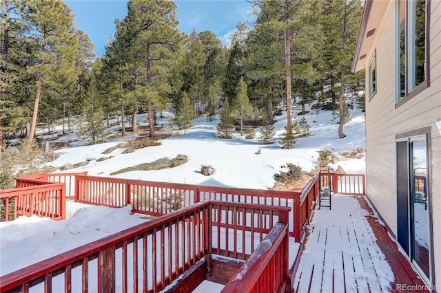 view of snow covered deck