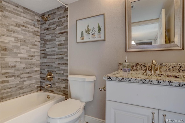 full bathroom featuring vanity, toilet, and tiled shower / bath