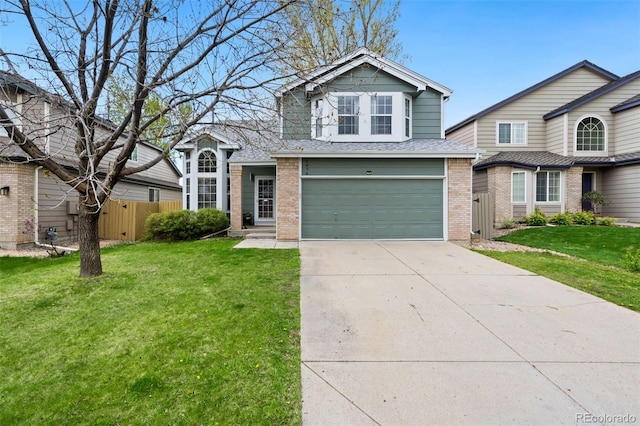 traditional-style home featuring fence, an attached garage, a front lawn, brick siding, and concrete driveway
