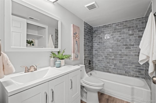 12820 Willow Ln Unit 9, Golden, CO 80401 - full bath with vanity, wood finished floors, and bathtub / shower combination