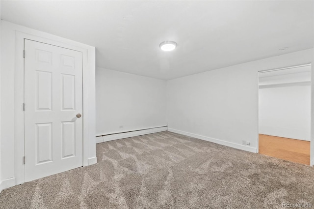 12820 Willow Ln Unit 9, Golden, CO 80401 - unfurnished bedroom with a baseboard heating unit and carpet floors