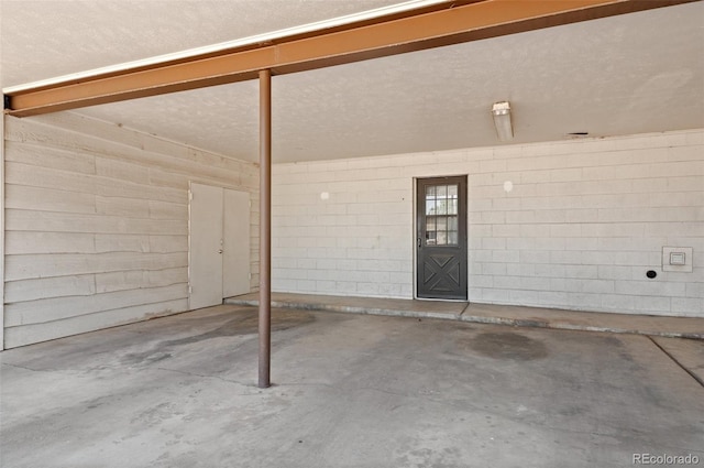 12820 Willow Ln Unit 9, Golden, CO 80401 - garage featuring concrete block wall