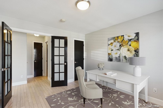 office featuring french doors and light wood-type flooring