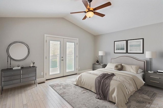 bedroom featuring french doors, access to exterior, light hardwood / wood-style floors, ceiling fan, and vaulted ceiling