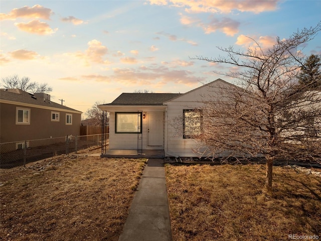 view of front of home featuring fence