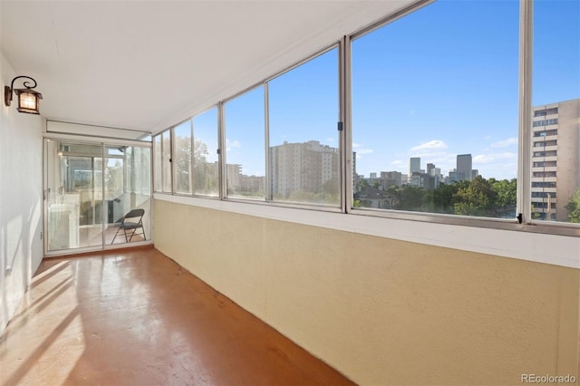 740 N Pearl St Unit 606, Denver, CO 80203 - unfurnished sunroom featuring a view of skyline and concrete floors