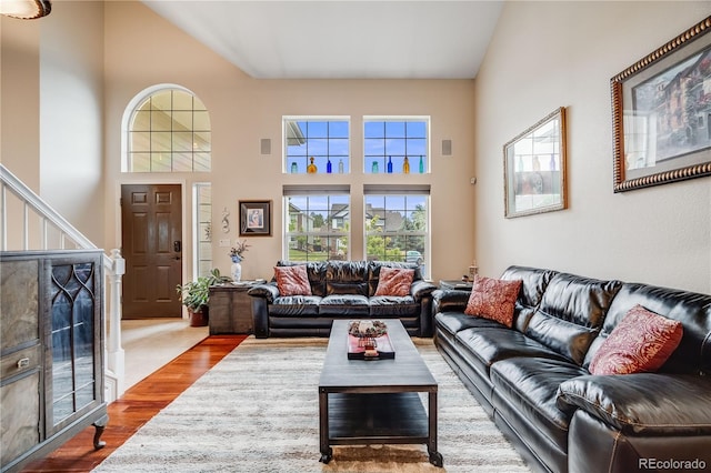 22428 Quail Run Ln, Parker, CO 80138 - living room featuring wood finished floors, stairway, and a towering ceiling