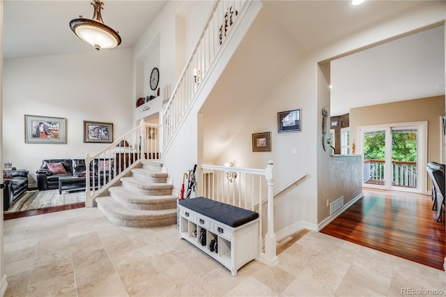 22428 Quail Run Ln, Parker, CO 80138 - stairway featuring baseboards and high vaulted ceiling