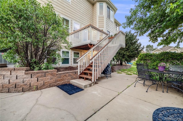 22428 Quail Run Ln, Parker, CO 80138 - view of patio with stairway, outdoor dining area, and a deck