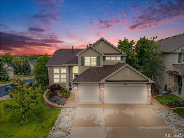 22428 Quail Run Ln, Parker, CO 80138 - traditional-style home featuring brick siding, concrete driveway, a shingled roof, and a garage