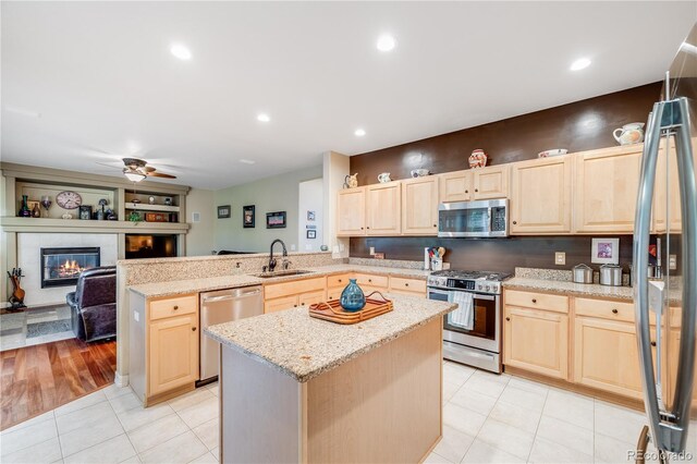 22428 Quail Run Ln, Parker, CO 80138 - kitchen with stainless steel appliances, light brown cabinetry, and recessed lighting