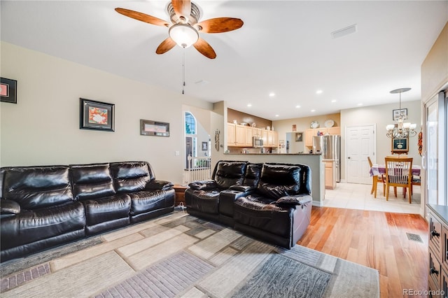 22428 Quail Run Ln, Parker, CO 80138 - living room with a chandelier, a ceiling fan, light wood-style floors, healthy amount of natural light, and recessed lighting