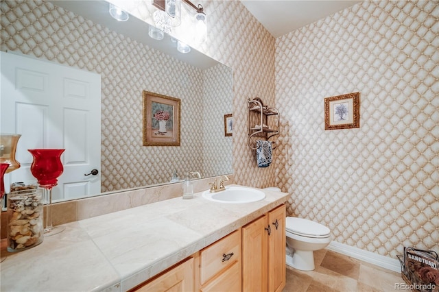 22428 Quail Run Ln, Parker, CO 80138 - bathroom featuring wallpapered walls, toilet, and vanity