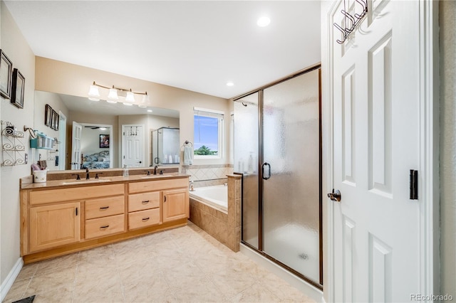 22428 Quail Run Ln, Parker, CO 80138 - ensuite bathroom with a bath, a stall shower, double vanity, recessed lighting, and tile patterned flooring