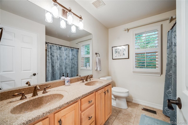 22428 Quail Run Ln, Parker, CO 80138 - bathroom featuring double vanity, toilet, tile patterned floors, baseboards, and a shower with curtain
