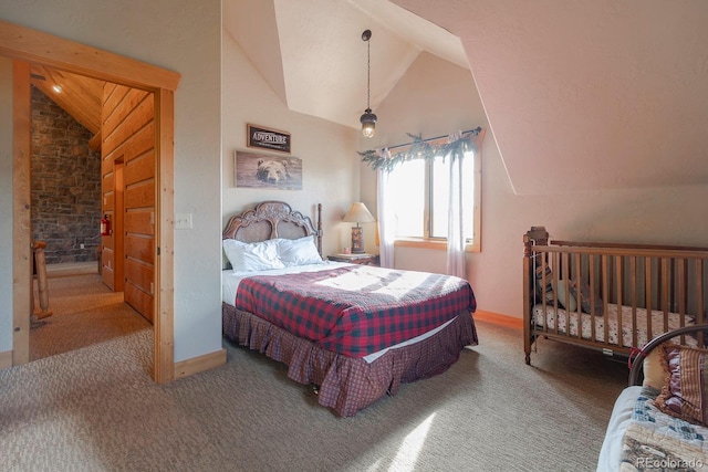 carpeted bedroom with lofted ceiling